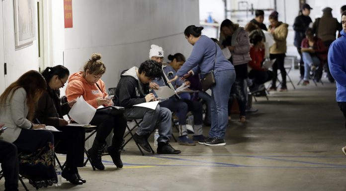 A Record 6.6 Million Seek US Jobless Aid as Layoffs Mount