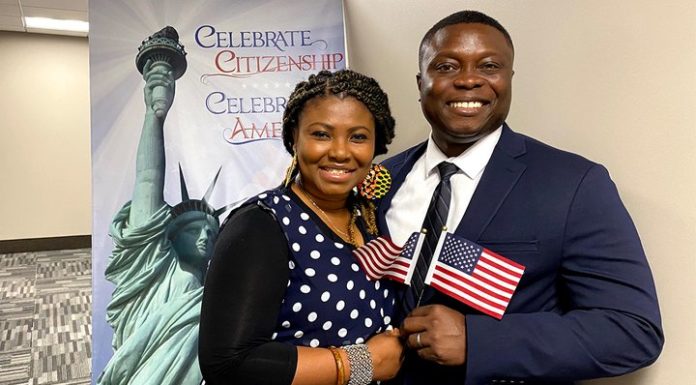 Alma Ohene-Opare and his wife holding American flags./ PHOTO: Fox News