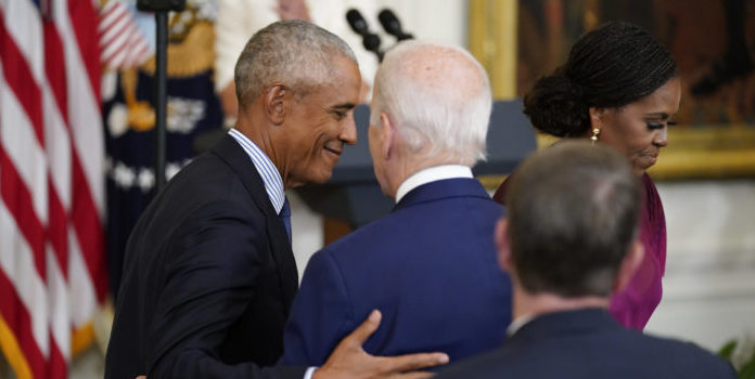 Barack Obama hugs Joe Biden