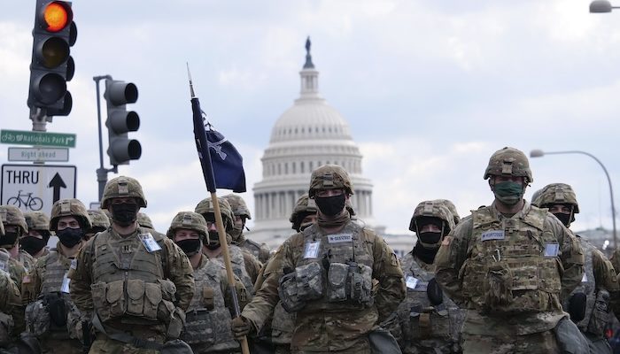 U.S. Soldiers with the Indiana National Guard National Guard stand in formation, in Washington, D.C., Jan. 20, 2021. At least 25,000 National Guard men and women have been authorized to conduct security, communication and logistical missions in support of federal and District authorities leading up and through the 59th Presidential Inauguration. (U.S. Army National Guard photo by Sgt. Tackora Hand)