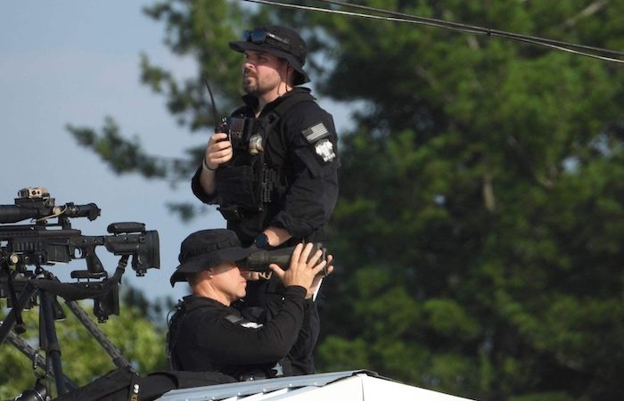 One of these men is the Secret Service sniper who shot the July 13 would-be Trump assassin --albeit 15 seconds after shooting began. PHOTO: Butler rally attendee Bradford Price